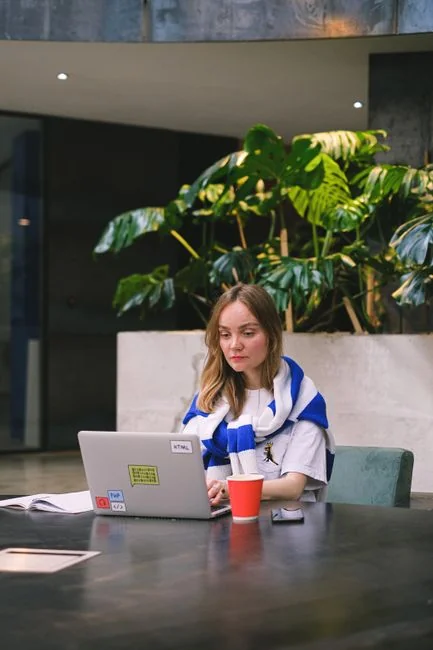 Two people using a laptop for online shopping, highlighting modern e-commerce trends.
